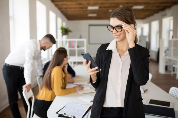 young-smiling-business-woman-in-eyeglasses-and-3RDCAXL-1.jpg